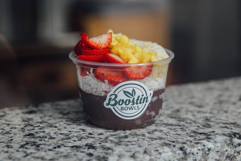 A berry-topped a&ccedil;a&iacute; bowl on the granite counter