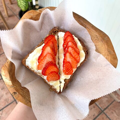 Multigrain toast with ricotta, strawberries, and honey